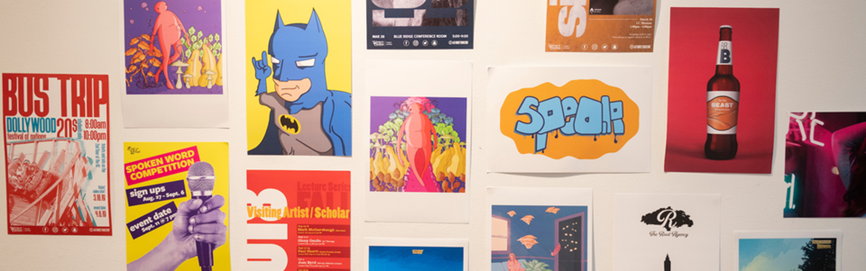 A wall of colorful poster art including pop culture and music ads