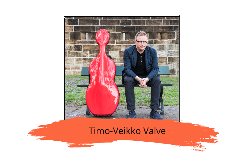Press photo of Timo-Veikko Valve sitting on a bench next to a red cello case.